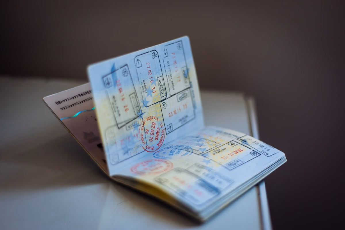 Open passport filled with travel and visa stamps